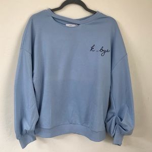 Playful, light blue sweatshirt